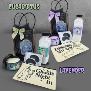 May include: A collection of self-care items, including a black tote bag with a green bow, a candle, eye masks, and a cosmetic bag with the text "Ghoul's Night In." The image also features a bottle of liquid and a bag with a purple bow. The word "Eucalyptus" is at the top.