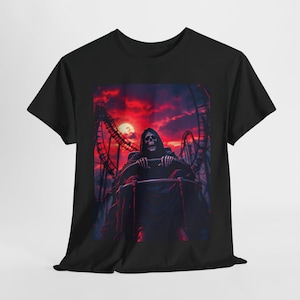 May include: Black t-shirt with a graphic of a skeleton riding a roller coaster in front of a red and orange sunset.