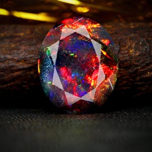 AAAAA-kvalitet naturlig svart opal cabochon ädelsten + Welo eld svart opal + fasetterad oval form opal + oktober födelsesten ädelsten, storlek 7x5 MM. bild 1