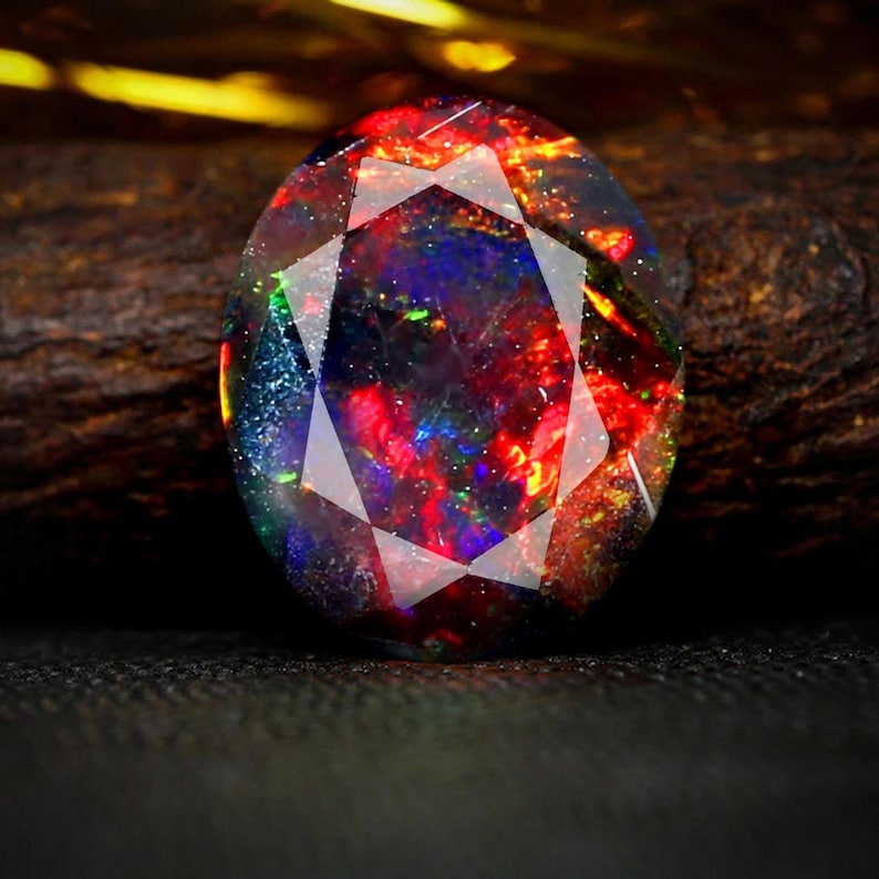 AAAAA-kvalitet naturlig svart opal cabochon ädelsten + Welo eld svart opal + fasetterad oval form opal + oktober födelsesten ädelsten, storlek 7x5 MM. bild 1