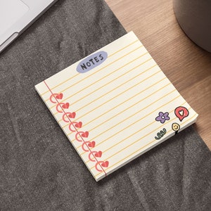 May include: A yellow lined notepad with the word "NOTES" in a blue circle. The notepad has a red heart border and cute cartoon icons on the bottom right corner.