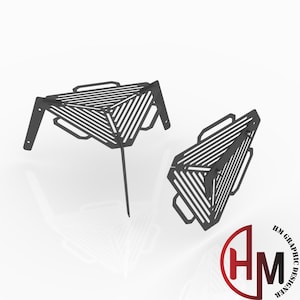 May include: Two black metal geometric fire pit grates. One is upright with a single leg, and the other is lying on its side. The grates have a series of parallel lines and handles.