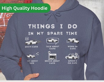 May include: A navy blue hoodie with a white graphic that says "Things I do in my spare time" and lists activities related to cars. The graphic includes illustrations of cars and the text "PHATSHIRTS".