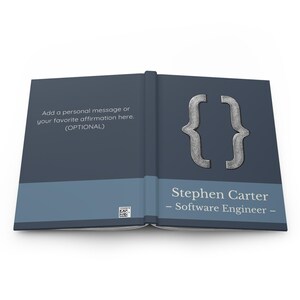 May include: Open book with a dark blue cover and a light blue horizontal stripe. The cover features a silver bracket symbol and the name "Stephen Carter - Software Engineer -". Text on the left side reads "Add a personal message or your favorite affirmation here. (OPTIONAL)".