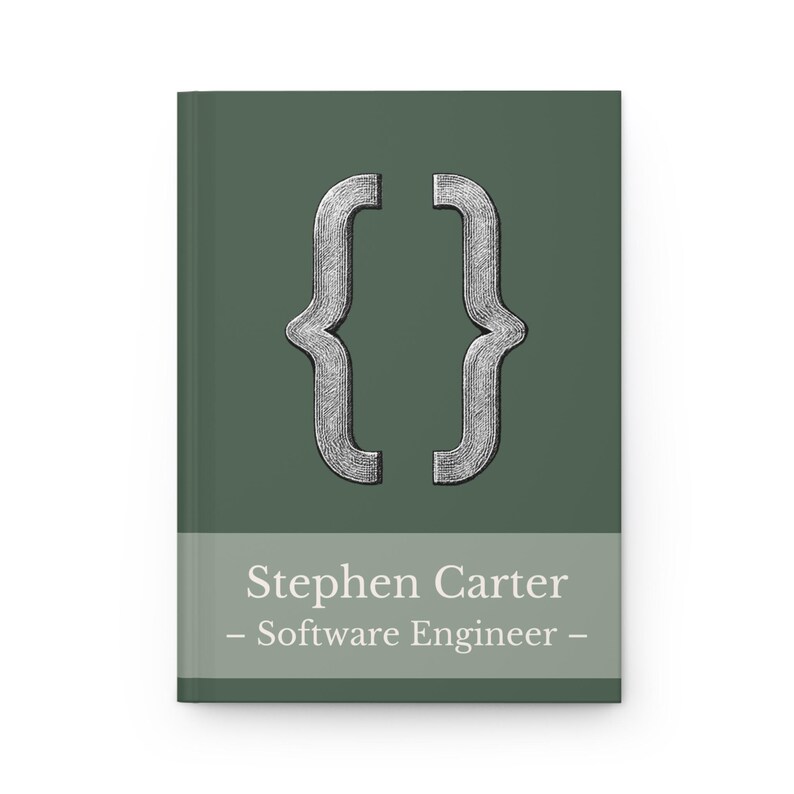 May include: A hardback notebook with a dark green cover. The cover features a silver bracket symbol and the text "Stephen Carter - Software Engineer" in white. A professional and stylish notebook.