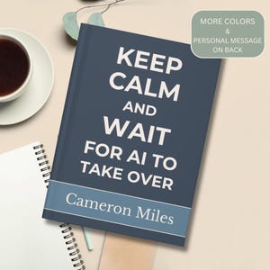 May include: A dark blue notebook with white text that reads KEEP CALM AND WAIT FOR AI TO TAKE OVER and Cameron Miles. A light blue horizontal stripe sits above the name. A small green tag in the corner says MORE COLORS & PERSONAL MESSAGE ON BACK.