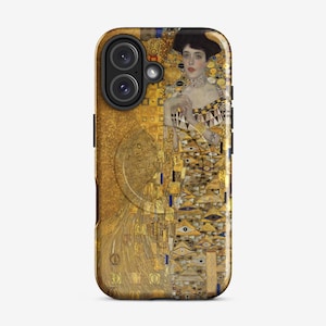 May include: A gold and black iPhone case with a painting of a woman in a gold dress. The painting is a reproduction of Gustav Klimt's "The Kiss".