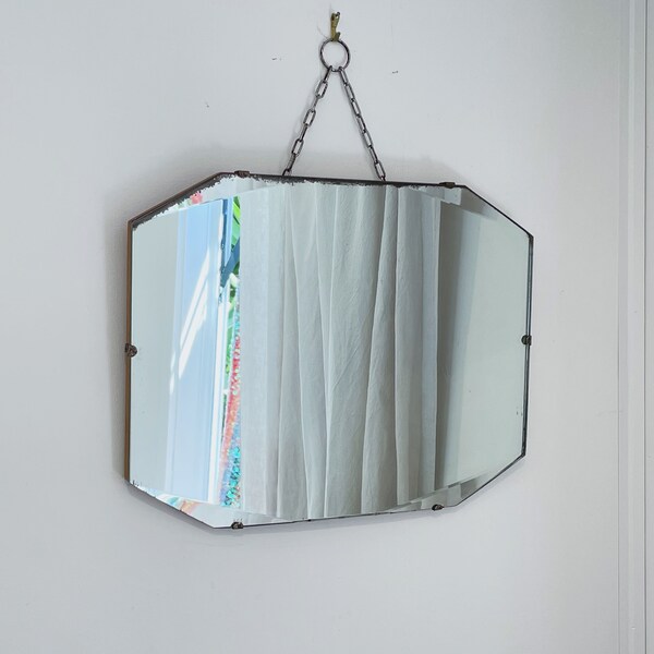 art deco frameless mirror with beveled edges and hanging chain