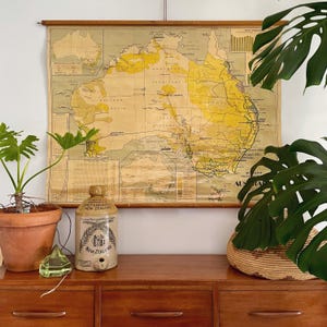 May include: A set of three ceramic mugs with a speckled, matte finish. The mugs are in shades of cream, light gray, and dark gray. Each mug has a simple, minimalist design, perfect for coffee or tea.