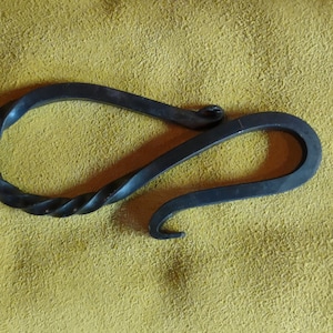 Hand forged bottle opener