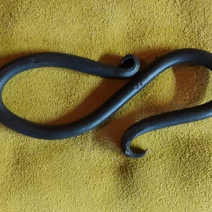 Hand forged bottle opener