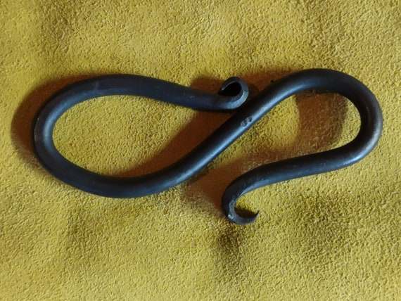 A real blacksmith hammered this out of steel — the twist marks and forge scale make every one completely one-of-a-kind, zero factory involved.