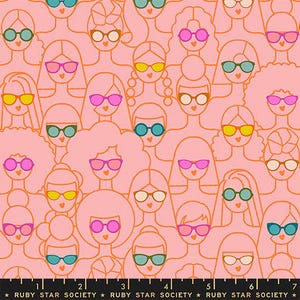 May include: A repeating pattern on pink fabric featuring stylized women's faces, each wearing different coloured sunglasses. The outlines are orange. Sunglasses are yellow, pink, green, and blue. The text "RUBY STAR SOCIETY" is at the bottom.