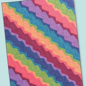 May include: A colorful quilt with a zig-zag pattern in shades of red, orange, yellow, green, blue, and purple. The word "ditto" is at the top, and the text "JAYBIRD QUILTS" is at the bottom.