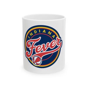 May include: White ceramic mug with a blue, yellow, and red logo that says "Indiana Fever" with a basketball inside the circle.