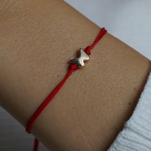 Dainty friendship bracelet with golden butterfly detail