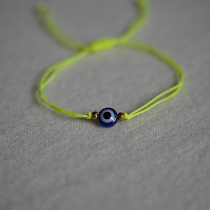 Nazar boncuk with neon yellow yarn