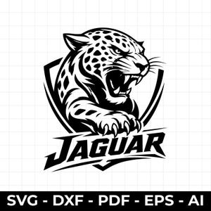 May include: A black and white graphic illustration of a snarling jaguar head and paw positioned inside a shield emblem. The word JAGUAR is printed in bold, stylized capital letters below the shield. The design is set against a grid background.