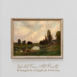 May include: A vintage landscape painting in a wooden frame. The painting depicts a river winding through a field with trees and a cloudy sky.