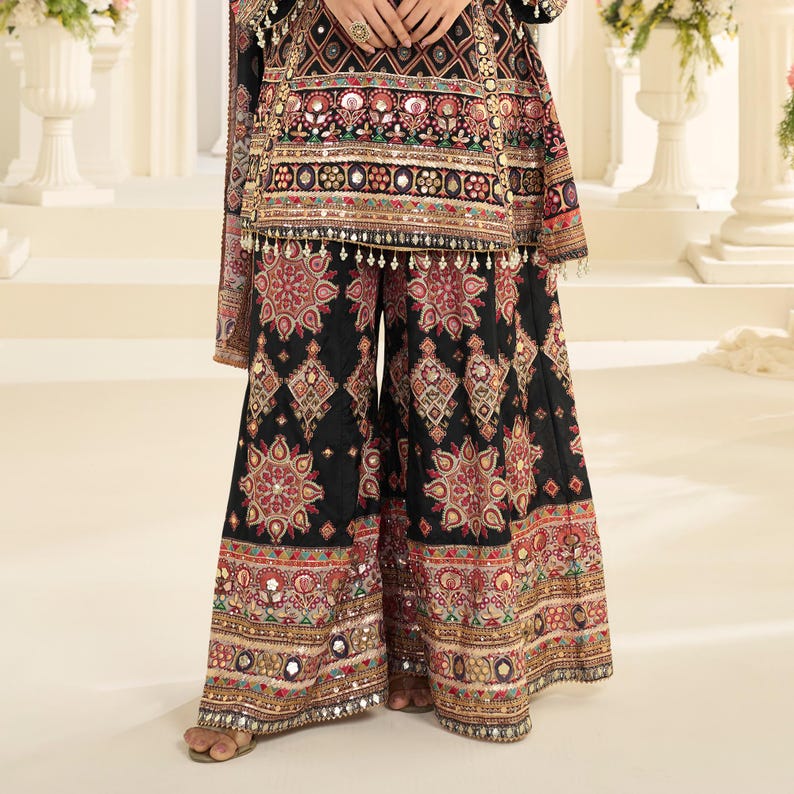 Back view of the kurta set, showing the embroidery and drape of the outfit.