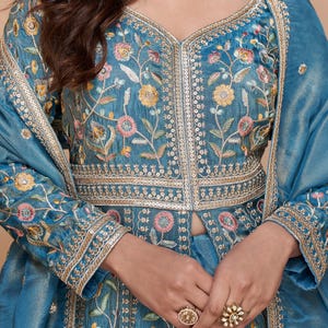 Styled look depicting the Anarkali gown as a wedding guest dress in festive setting