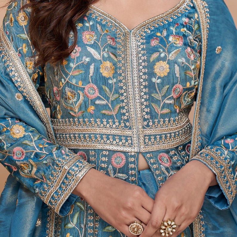 Styled look depicting the Anarkali gown as a wedding guest dress in festive setting