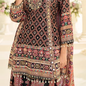 Flat lay of the full outfit, displaying the dupatta, top, and palazzo separately.