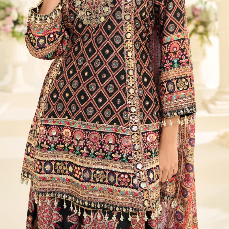 Flat lay of the full outfit, displaying the dupatta, top, and palazzo separately.