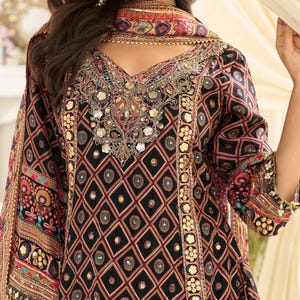 Styling detail showing the outfit accessorized for a wedding or festival event.