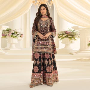 Front view of a black and gold crepe silk kurta palazzo set worn by a model.