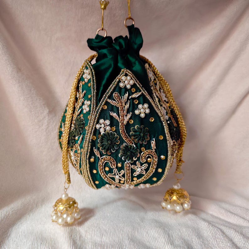 Close-up of the drawstring closure on the green silk potli bag, a key feature of the wedding potli bag design.