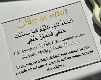 May include: A framed print with gold text that reads "Face au miroir" and a prayer in Arabic and French. The print is on a white background.