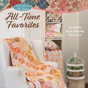 May include: A book titled "moda All-Stars All-Time Favorites" featuring 14 quilts made from blocks. The book cover shows a white armchair with a quilt made of orange, pink, and yellow triangles. The armchair is in front of a white cabinet with shelves filled with rolled-up quilts.