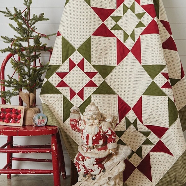 May include: A quilt pattern featuring a red and green star design. The quilt is 72 inches by 72 inches and is called "Spiced Gumdrops Quilt".