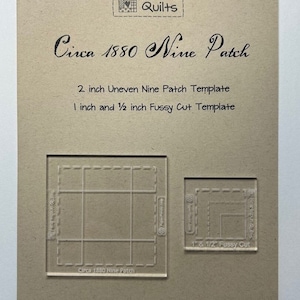 May include: A brown card with the text "Heartspun Quilts" and "Circa 1880 Nine Patch" printed on it. The card also includes the text "2 inch Uneven Nine Patch Template" and "1 inch and 1/2 inch Fussy Cut Template". There are two clear plastic templates on the card, one for a 2-inch uneven nine patch and one for a 1-inch and 1/2-inch fussy cut.
