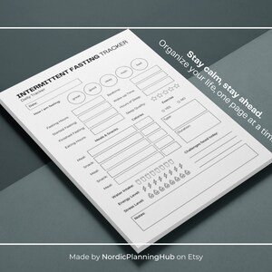 May include: A black and white printable intermittent fasting tracker with the text "Stay calm, stay ahead. Organize your life, one page at a time."  The tracker includes sections for daily tracking, meals and snacks, exercise, and challenges faced today.