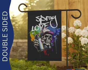 May include: Double-sided garden flag with a black background and a colorful graphic of a skull wearing a hat and holding a spray paint can. The text "Spray Love" is written in white on the flag.