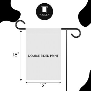 May include: A white garden flag with a black metal stand. The flag is 18 inches tall and 12 inches wide. The flag is double-sided and has the text "DOUBLE SIDED PRINT" printed on it.