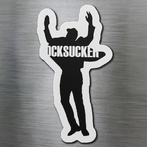 May include: Black and white silhouette of a person with arms raised in the air. The person is wearing a jacket and pants. The word "OCKSUCKER" is written across the front of the jacket.