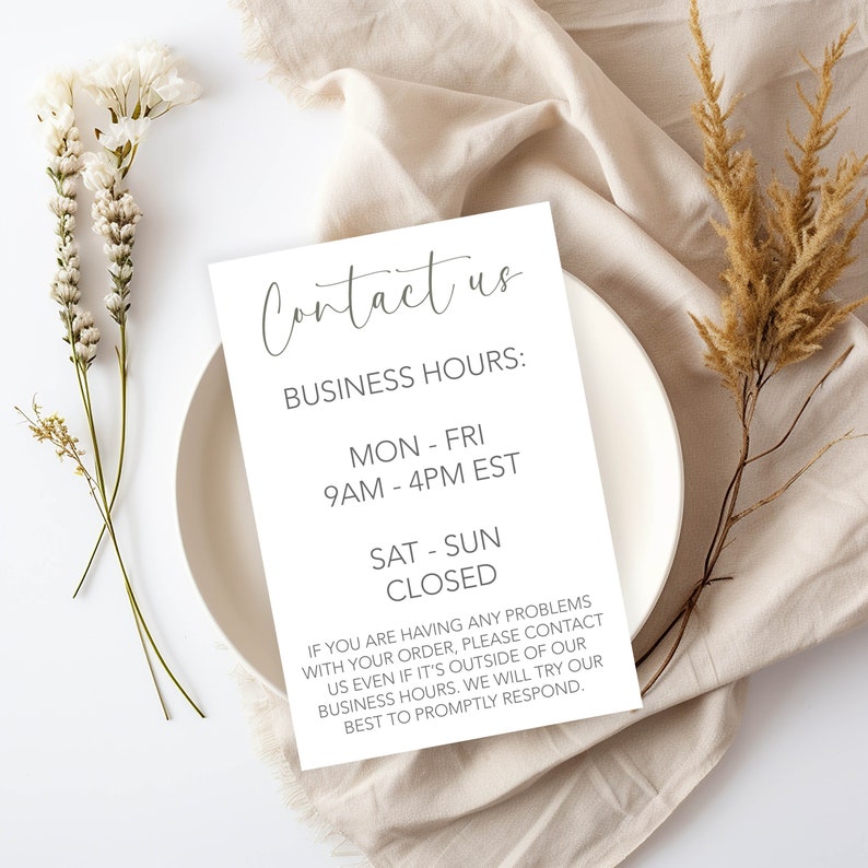 May include: White card with black text that reads "Contact us" and lists business hours: Monday through Friday, 9 AM to 4 PM EST, Saturday and Sunday closed. The card also includes a message about contacting the business outside of business hours.