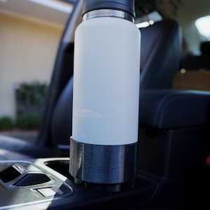 This is the YETI Rambler Cup Holder Adapter with a YETI Rambler 36oz (1065ml) drink bottle inside it. This was our V1 model, the new V2 is updated to fit both the Frank Green and YETI Rambler drink bottles with reduced suction.