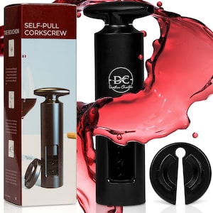 May include: A black self-pull corkscrew with a black handle and a black base. The corkscrew has the text "Dorothee Chantale" and a logo on the front. A black disc is next to the corkscrew. The box on the left has the text "SELF-PULL CORKSCREW".