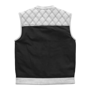 May include: Black vest with a white quilted diamond pattern on the upper back and white trim. The vest is sleeveless and has a classic design, suitable for layering. The back of the vest is shown against a white background.
