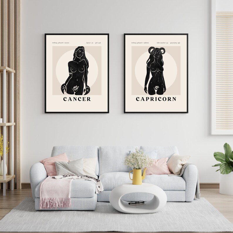 May include: Two black and white illustrations of zodiac signs, Cancer and Capricorn, with the names of the signs printed below each illustration.