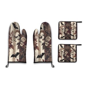 May include: A set of oven mitts and pot holders with a gothic floral and bat design. The mitts and pot holders feature a cream and brown striped background with roses, butterflies, and bats. The oven mitts have black trim and hanging loops.