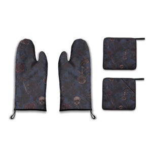 May include: A dark blue oven mitt and pot holder set with a floral and skull pattern. The design includes roses, mushrooms, and skulls in shades of brown and red. The set includes two oven mitts and two pot holders.