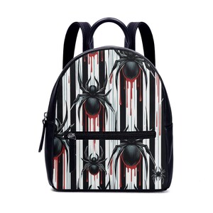 May include: Black backpack with a white and black striped pattern featuring red dripping blood and black spiders.