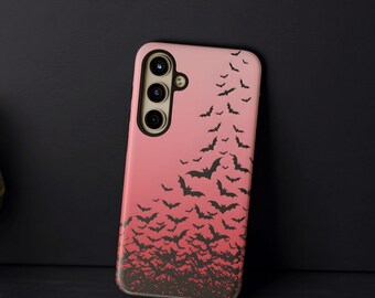 May include: Pink phone case featuring a black bat silhouette design. The bats are arranged in a flock, creating a gradient effect. The phone case has a camera module with three lenses. The case is designed for a smartphone.
