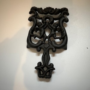 Vintage Wilton Cast Iron Trivet With Cherubs Design Black Country 5x3 inches