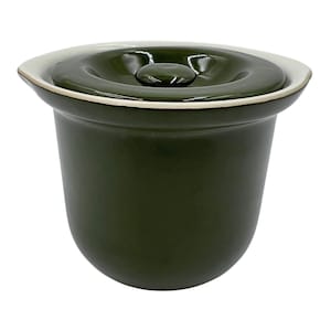 May include: Dark green ceramic crock pot with a matching lid. The lid has a small, round handle and a white rim. The crock pot is a deep, rounded shape, suitable for cooking and serving. The overall design is simple and functional.